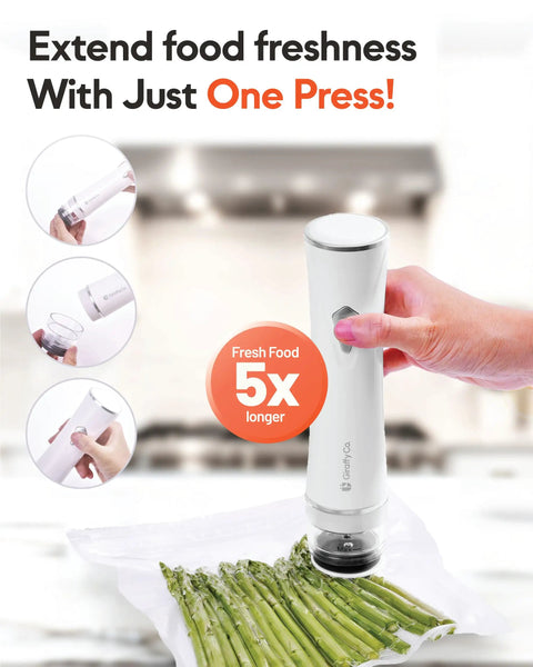 Compact Handheld Vacuum Sealer Kit With 30 Reusable Bags, cordless sealer in use with plastic asparagus bag on kitchen counter.