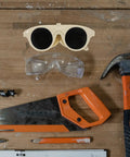 Built Tough Welding Glasses And Protective Goggles For Industrial Grinding, Super Comfy Ergonomic Fit, Straight Up 5 Pack Eye Safety Gear displayed on a workbench.