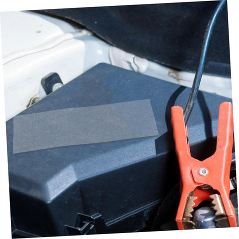 12 Piece Vehicle Bumper Repair Mesh Kit With Stainless Steel Thermoplastic Screen on car battery, close-up view