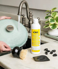 Enamel Enameled Cast Iron And Ceramic Stoneware Care Kit With 11oz Cleaner, Black Pan Scraper, Scrub Brush, Pot Protectors, Use And Care Booklet, 5 Piece Set For Easy Cookware Maintenance, 11oz cleaner and brush by sink