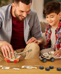 Father and son assembling Wooden STEM Kits For Kids Aged 8 To 12 Six Build Your Own Car And Science Projects Pack