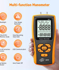 Person holding a Handheld Manometer Gas Pressure Tester for HVAC Pros and DIYers with digital display and function icons.