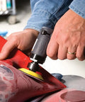 Person using Compact Mini Orbital Sander For Metal Prep And Rust Removal Feather Edging Smoothing Welds And Quick Finishes