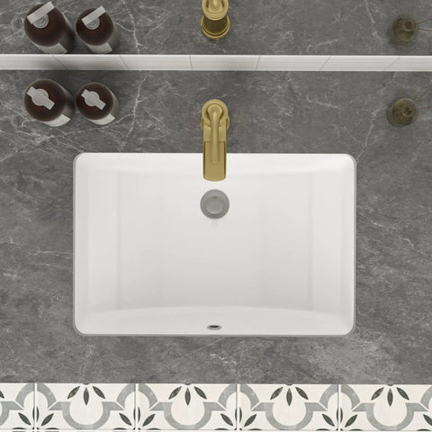 Top view of Undermount 21x14 Inch White Ceramic Bathroom Sink, Rectangular Vanity Lavatory Basin, Porcelain Under-Counter Hand Wash Sink With Overflow installed in marble countertop