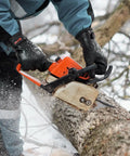 Person using chainsaw wearing Waterproof Thermal Work Gloves With Full Hand Latex Coating And Insulated Acrylic Liner Red Large