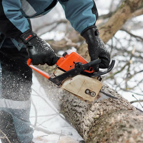 Person using chainsaw wearing Waterproof Thermal Work Gloves With Full Hand Latex Coating And Insulated Acrylic Liner Red Large