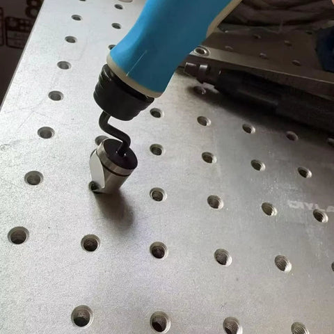 NG1000-BC1651 deburring tool with blue handle and 90-degree countersink bit on perforated metal plate