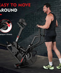 Man moving Air Resistance Fan Bike With Dual Action Handlebars And Dual Layer Transmission For Home Gym HIIT Cardio Full Body Workout