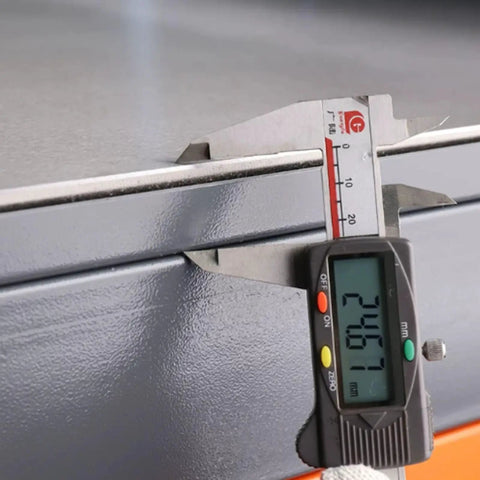 Close-up measurement of the 8mm thick steel plate on the Top Notch Polished Mold Maintenance Bench with 3000kg load rating.