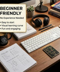 LED Edition Morse Code Trainer Card Pro Interactive Pocket PCB Kit on wooden desk with keyboard and headphones
