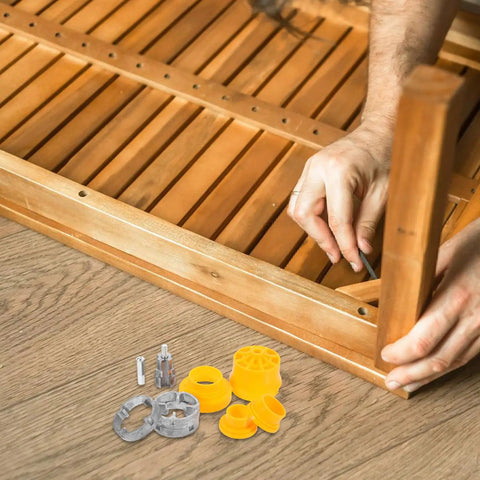 Hands using Heavy Duty Pipe Threader Kit For Electric Drill With Alloy Iron Dies on wooden project with parts visible.