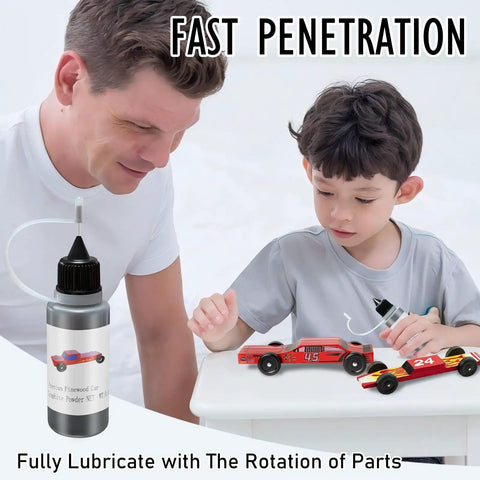 Father and son using 0.5 Oz Graphite Powder Lubricant for Pinewood Derby Cars Dry Lube on car wheels to reduce friction.