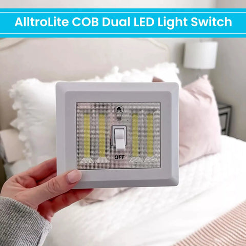 Person holding Cordless 400 Lumen COB LED Closet Light Switch Battery Powered Night Light No Wires Easy Install Stick On