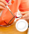 Person using a screwdriver on red glasses frame with inset of eyewear repair string for glasses nylon thread quick adjustment tool