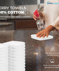 Person using 60 Pack Cotton Terry Towels 14 By 17 Inches Highly Absorbent Cleaning Rags For Kitchen Bar And Restaurant Use Durable White Commercial Grade Ideal For Dishwashing Mopping And General Commercial Cleaning on a countertop.