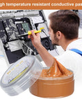 Copper Conductive Grease For Electrical Contacts And Automotive Systems With Extreme Temperature Resistance shown with technician using on electronics