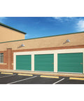LED Dusk To Dawn Outdoor Area Light With 7100 Lumens And 4000K Glow installed above garage doors for nighttime security lighting