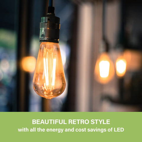 Vintage Edison Style LED Bulbs ST58, E26 Dimmable 40W Equivalent, warm glow, hanging in a dimly lit room.