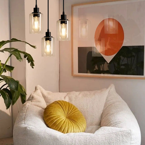 Industrial Three Light Pendant Light With Adjustable Height Up To 34 Inches, Black Finish And Clear Glass Shade in modern room