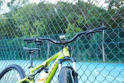 Smpl Mountain Bike Handlebar 31.8mm Diameter 50mm Rise 720mm Width Aluminum Alloy Black on green bike near fence