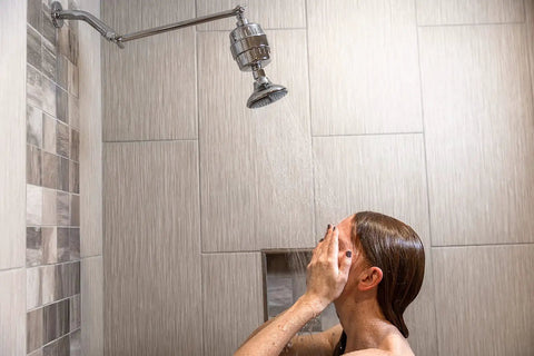 Person using High Output Shower Filter Cartridge For Sensitive Skin And Dry Scalp Removes Chlorine And Impurities Softens Hard Water