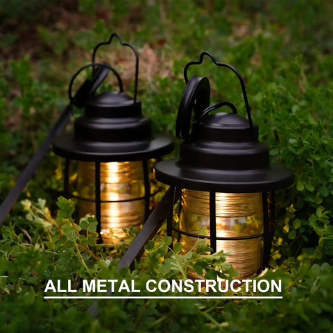 Two Awesome Four Pack Low Voltage Outdoor Hanging Path Lights Kit Warm White Led Metal Shepherd Hook Lights illuminate grass.