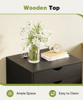 Top Tier Seven Drawer Wooden Dresser Featuring Heavy Duty Storage Cabinets And Smooth Rolling Casters For Bedroom Organization You Gotta Have This Solid Straight Up Game Changer with floral arrangement on wooden top.