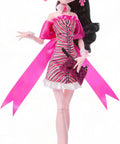 Iconic Design Draculaura Reproduction Doll In A Dope Pink Ruffle Dress Featuring Spooky Chic Vampire Vibes And Top Notch Craftsmanship For Your Totally Sweet Shelf, dressed in a pink ruffle gown.