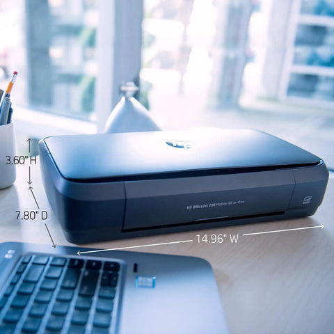 Rock Solid Portable Printer With Wireless And Mobile Printing Support Certified Refurbished on a desk, showing dimensions next to a laptop.