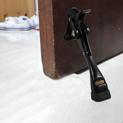 Adjustable Kick Down Door Stopper For Commercial And Home Doors With Easy Installation Anti Collision Protection in use on wooden door