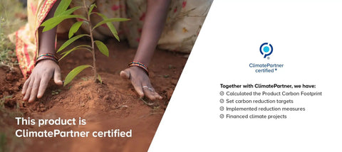 Hands planting a sapling in soil with ClimatePartner certification details.