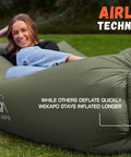 Person lounging on an olive green Wekapo inflatable lounger couch portable air sofa chair for camping, no pump needed.