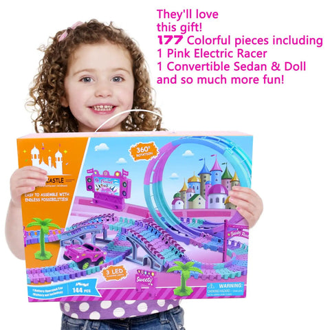 Girl holding box of Pink 177 Piece Flexible Track Car Toy Set For Girls Ages 3 4 5 6 With 360 Degree Rotating Tracks Princess Car Doll