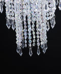 Close-up of crystal droplets and beads hanging from Iridescent Acrylic Beaded Hanging Chandelier With 3 Tiers And Crystal Droplets, 10.25 Inch Diameter By 30 Inch Tall With 7 Inch Chain, Sparkling Diamond Cut Beads, Lit Pendant Shade For Modern Ceiling Lighting against black background.
