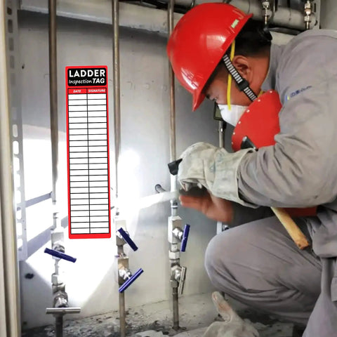 Person using Heavy Duty Red Ladder Inspection Labels 120 Pack Real Deal Safety Stickers for job site checks in warehouse.