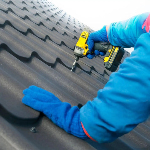 Installation of Heavy Duty Number 10 X 1 Inch Metal Roofing Screws Pack Of 80 Black Rustproof Hex Heads with drill.