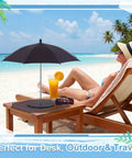 Woman lounging on beach with Cool Little Mini Drink Umbrella With Weighted Base on table shade for drink, 19.7 inch canopy.