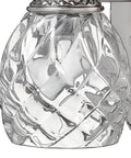 Close-up of glass detail on Plantation Style One Light Bathroom Vanity Fixture in Polished Antique Nickel with Silver Patina Finish.