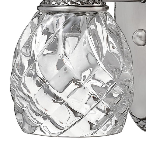 Close-up of glass detail on Plantation Style One Light Bathroom Vanity Fixture in Polished Antique Nickel with Silver Patina Finish.