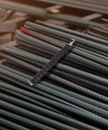 Housoutil 2Pcs Steel Rebar Wire Twisting Hook for Concrete and Fence Work on stacked steel rebar in a construction setting.