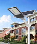 Heavy Duty Solar LED Flood Light With Remote And Light Sensor IP65 Waterproof 10W To 150W mounted near a building.