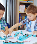 Two children using Hands On Electricity And Magnetism Kit For Kids And Students A Fun STEM Science Experiment Set on a table.