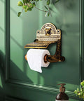 Antique Brass Wall Mount Toilet Paper Holder With Lid 6.9 Inch Wide Victorian Style Rust Resistant Solid Brass Bathroom Sanitary Paper Roll Holder Storage on a green wall