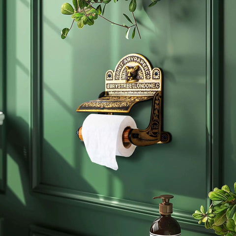 Antique Brass Wall Mount Toilet Paper Holder With Lid 6.9 Inch Wide Victorian Style Rust Resistant Solid Brass Bathroom Sanitary Paper Roll Holder Storage on a green wall
