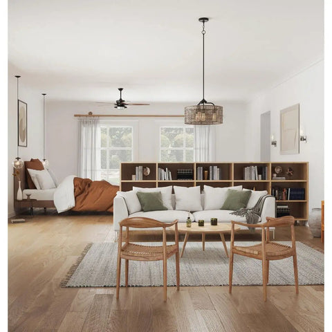 One Light Clear Glass Globe Pendant Light In Matte Black Modern Pendant Fixture With Clean Lines For Kitchen Island Dining Nook Foyer Or Living Room Great For Contemporary And Mid Century Decor in a modern living room setting with natural light and wooden furniture.