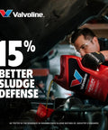 Valvoline MaxLife high-mileage motor oil, 5-quart red plastic jug, being poured into a car engine.
