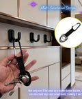 Hand holding Durable Silicone Water Bottle Holder With Carabiner Clip and Key Ring, showing versatile indoor hook use.