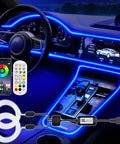 Car interior with RGB Interior Car LED Strip Lights USB Powered Ambient Lighting with Wireless App and Remote Control glowing.
