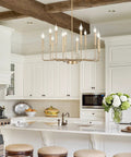 Modern Gold Farmhouse 12 Light Chandelier Industrial Metal Pendant Lighting With Candle Style Bulbs in a kitchen setting