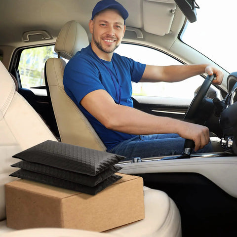 Delivery driver with Black Bubble Mailers 5x8.6 Inch Outer Size With 5x7 Inch Inner, 50 Pack Padded Self Seal Envelopes on car seat.